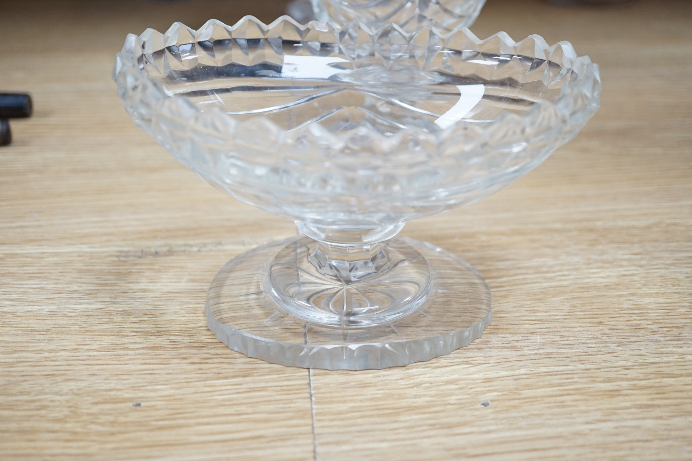 Ten cut glass items including; four pedestal bowls and covers, two oval, pedestal dishes, a two oval, pedestal dishes, a jug, a pair of glasses, etc., tallest, 26cm